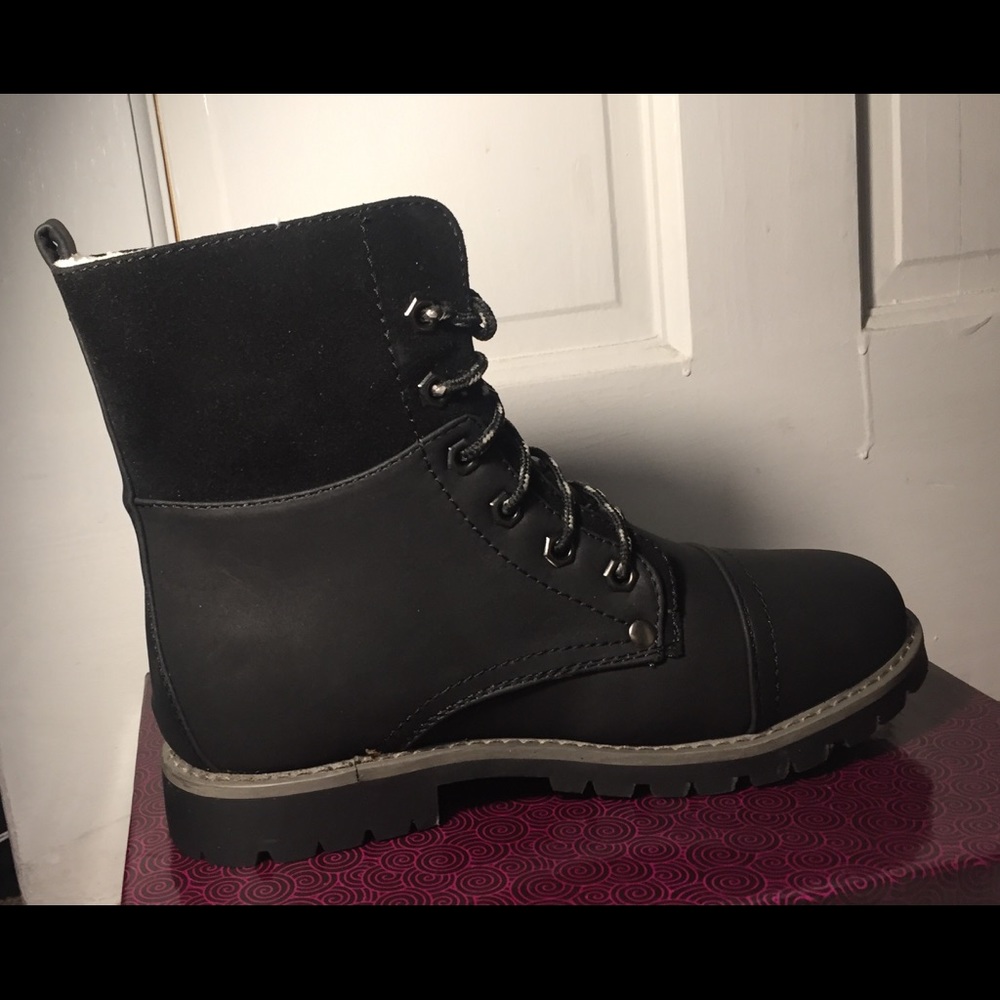 Black faux suede and leather hiking boot.